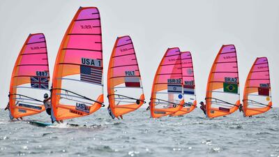 Athletes take part in the women's windsurfing RS:X class competition during a sailing test event for the Tokyo 2020 Olympic Games, off the coast Enoshima in Kanagawa Prefecture. AFP
