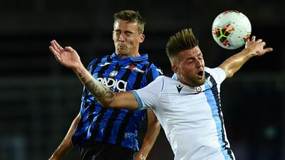 Atalanta defender Timothy Castagne and Lazio midfielder Sergej Milinkovic-Savic go for a header. AFP