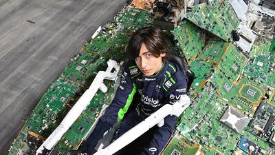 Aidan Gallagher in the drivers' seat of the Recover E Car, made entirely from electronic waste, created to raise awareness of the issue, at ExCel London. Getty Images