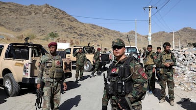Afghan special forces stand guard at the site of a suicide car bombing on outskirts of Kabul on September 12, 2019. AP Photo