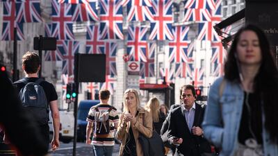 Pedestrians in Regent Street, central London. Brand Britain has been damaged by strict Covid travel restrictions and disruption at airports, analysts say. Getty Images