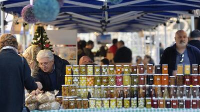 Above, a customer buys traditional food at a stall at Beirut Souks in Lebanon. Wael Hamzeh / EPA