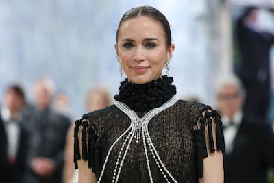 British actress Emily Blunt wore a body necklace of Mikimoto pearls. AFP
