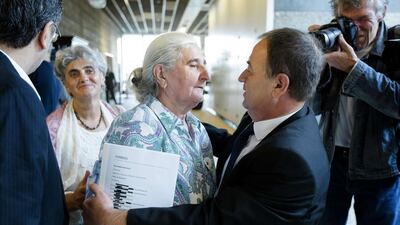 A Bosnian woman, member of the Srebrenica Mothers Association, hugs a relative after the court verdict against the Dutch government on July, 16 2014 in The Hague, Netherlands. The court ruled Wednesday that the Dutch state was liable for the deaths of over 300 victims of the Srebrenica massacre, the worst atrocity on European soil since World War II. Bart Maat/AFP Photo