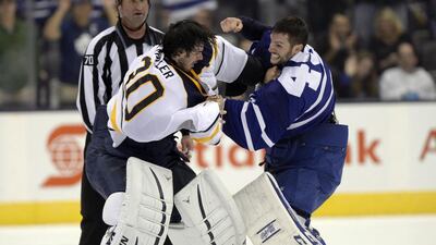 Buffalo Sabres goalie Ryan Miller exchanges blows with Toronto Maple Leafs goalie Jonathan Bernier during the third period of their pre-season game at Toronto on Sunday. Frank Gunn / AP Photo