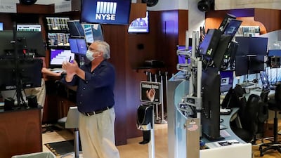 A trader on the floor of the New York Stock Exchange. The Dow Jones Index gained more than 4 per cent to close last week above 25,500 in an 11-week high. Reuters