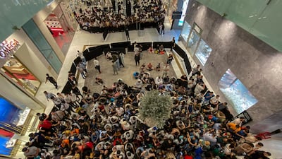 People queue for the iPhone 15 at Mall of the Emirates in Dubai. Antonie Robertson / The National