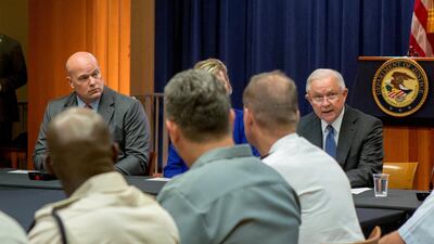 Acting Attorney General Matthew Whitaker, left, looks at his previous boss, Jeff Sessions, right. Reuters