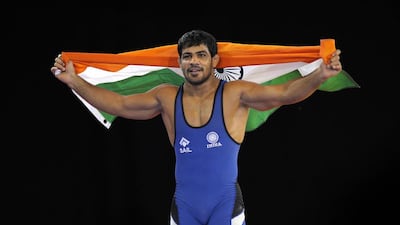 Sushil Kumar of India celebrates winning the men's 74kg freestyle Wrestling gold medal match at the 2014 Commonwealth Games in Glasgow, Scotland on July 29, 2014. Andy Buchanan / AFP