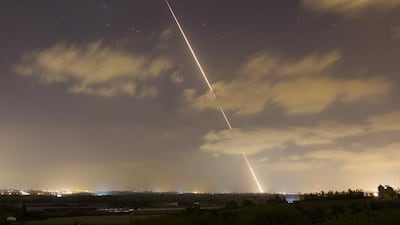 A streak of light is seen as a rocket is launched from the northern Gaza Strip towards Israel. Israel killed three senior Hamas commanders in an air strike on the Gaza Strip on Thursday, the clearest signal yet that Israel is intent on eliminating the group’s military leadership after a failed attempt on the life of its top commander this week. Amir Cohen / Reuters