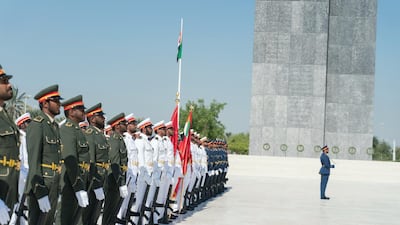 Members of the UAE Armed Forces hold a minute silence