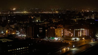 The lights go out over the Moqattam district of Cairo as another power cut hits the capital. AFP