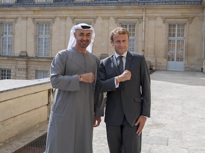 Sheikh Mohamed bin Zayed and Emmanuel Macron wear Expo 2020 Dubai wristbands at Fontainebleau Palace. Photo: Mohamed Al Hammadi / Ministry of Presidential Affairs