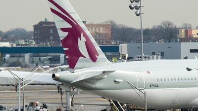 Above, a Qatar Airways aircraft is parked at John F Kennedy International Airport in New York. Passengers traveling to the US from 10 airports in eight Muslim-majority countries are barred from bringing laptops, tablets and other portable electronic devices on board with them. Don Emmert / AFP