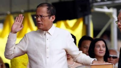 Benigno Aquino III takes his oath as the Philippines' 15th president on a Bilble, in Quirino Grandstand, Manila, Philippines on Wednesday, June 30, 2010 before hundreds of thousands of cheering supporters.
