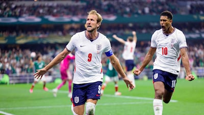 England's Harry Kane celebrates scoring his team's third goal with Jude Bellingham during the World Cup Round of 16 match with Mexico at the Mexico City Stadium. AFP