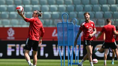 Wales's Gareth Bale, left, catches the ball during the team's training session in Wroclaw, Poland, on May 31, 2022, ahead of their Uefa Nations League clash with Poland on Wednesday, June 1. EPA