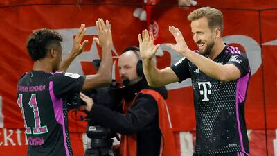 Bayern's Harry Kane celebrates with Kingsley Coman after scoring. EPA