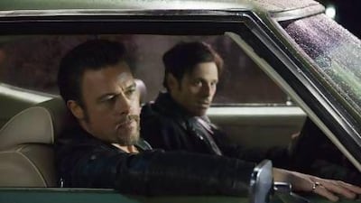 Brad Pitt, left, plays the hit-man Jackie Cogan while Scoot McNairy is an inept hustler in Killing Them Softly. Melinda Sue Gordon / Cogan's Productions