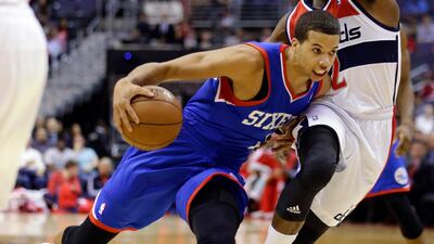 Philadelphia 76ers guard Michael Carter-Williams (1) drives against Washington Wizards guard John Wall (2) in the first half of an NBA basketball game, Friday, Nov. 1, 2013, in Washington. (AP Photo/Alex Brandon)