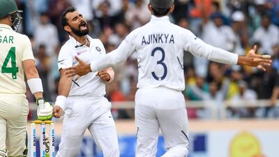 India bowler Mohammed Shami, centre, celebrates after dismissing South Africa's Dean Elgar. AFP