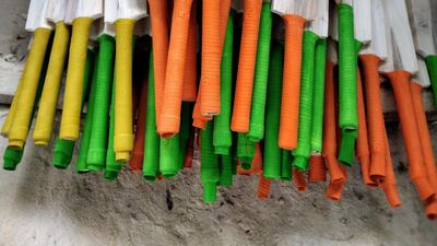 Nearly completed bats with grips that need polishing.