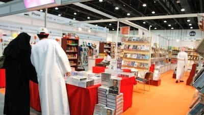 Visitors at the Abu Dhabi International Book Fair peruse the offerings.
