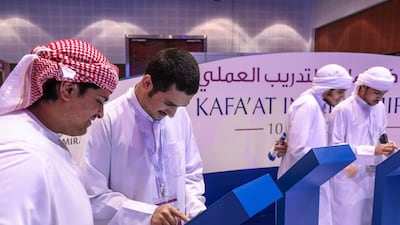 Emiratis upload their resumes at the inaugural Kafa’at Internship Fair at Dubai World Trade Centre on Monday. Victor Besa for The National