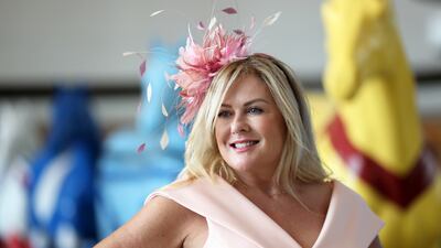 A guest wears a colourful hat before the start of Dubai World Cup held at Meydan Racecourse in Dubai. Pawan Singh / The National