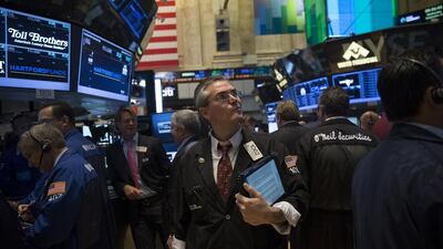 The US Federal Reserve has flooded financial markets with cheap cash since 2009 with its quantitative easing programme. Above, traders on the floor of the New York Stock Exchange. Scott Eells / Bloomberg News