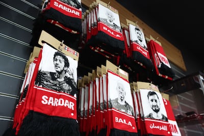 Scarves of Iranian footballer Sardar Azmoun hang in the club shop at Shabab Al Ahli. Chris Whiteoak / The National