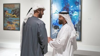 Sheikh Mohamed bin Zayed speaks with an artist while visiting the Qasr Al Hosn Festival.