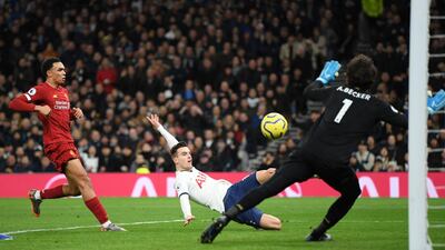 Giovani Lo Celso of Tottenham has a shot saved by Alisson Becker. Getty