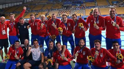 Gold medallists Serbia pose during the medal presentation ceremony after the Tokyo 2020 Olympic Games men's water polo gold medal match.