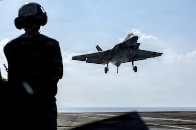 A US F-35C Lightning II lands on an aircraft carrier. Under the Trump administration, the US has vastly increased its defence spending. AFP