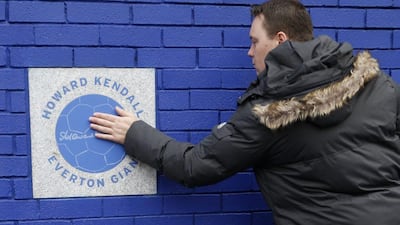 An Everton supporter pays tribute at a plaque honouring former manager Howard Kendall outside Goodison Park on Saturday. Carl Recine / Action Images / Reuters / October 17, 2015