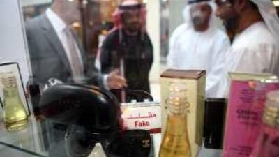 Counterfeit glasses and perfume are on display at the exhibition.