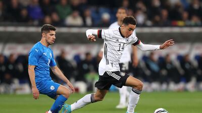 Germany's Jamal Musiala looks to break clear of Israel's Manor Solomon. Getty