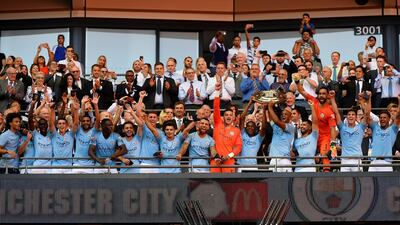 Soccer Football - FA Community Shield - Manchester City v Chelsea - Wembley Stadium, London, Britain - August 5, 2018 Manchester CityÕs Fernandinho and Vincent Kompany lift the trophy after the match REUTERS/Toby Melville