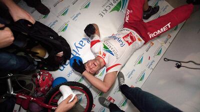 An exhausted Krystian Herba, a renowned Polish cyclist, catches his breath after arriving at the 68th fl?oor of the Rose Rayhaan hotel attempting to beat the existing Guinness Book of World record. Jaime Puebla / The National
