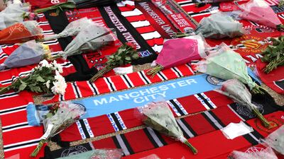 Tributes are seen to former Manchester United player Bobby Charlton outside the stadium prior to the Champions League match between Manchester United and FC Copenhagen. Getty
