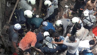 Rescue workers and residents search for survivors at the site. Reuters