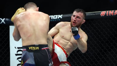 Merab Dvalishvili, right, lands a kick on Petr Yan during their UFC bantamweight title fight at UFC 333.
