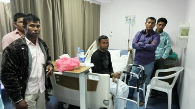 Mohammad Golam Rabbani, centre, from Bangladesh was among injured in the 2013 Al Ain road crash. Pawan Singh / The National