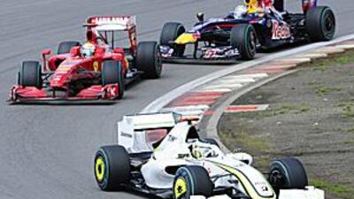 Jenson Button leads Felipe Massa and Sebastian Vettel during Sunday's German Grand Prix. The championship leader could only finish fifth in the race.