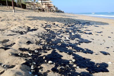 Oil spills have happened frequently on the country's east coast. This shows an unrelated spill in 2019 that took place along the two-kilometre Al Aqah and Dibba beach. Tankers cleaning out their hulls in international waters have often been blamed for the spills. Chris Whiteoak / The National