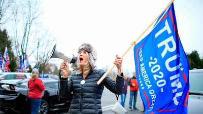 A woman shouts slogans as Trump Supporters gather during a car rally named as “Stop the Steal” in Long Valley, New Jersey. AFP