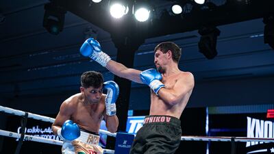 Faizan Anwar, left, ducks a shot from Ramiz Mammadov.