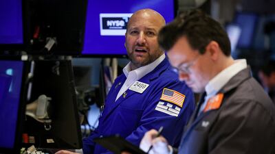 Traders on the floor of the New York Stock Exchange. Investors have moved quickly to recalibrate their portfolios following the Fed's outlook suggesting rates will stay higher for longer. Reuters