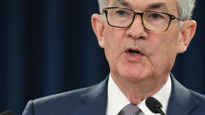 US Federal Reserve Chairman Jerome Powell speaking at a press conference before pandemic restrictions in March this year. On Tuesday, Mr Powell told a Senate hearing that the longer the economic downturn in the US lasts, 'the greater the potential for longer-term damage from permanent job loss and business closures'. AFP